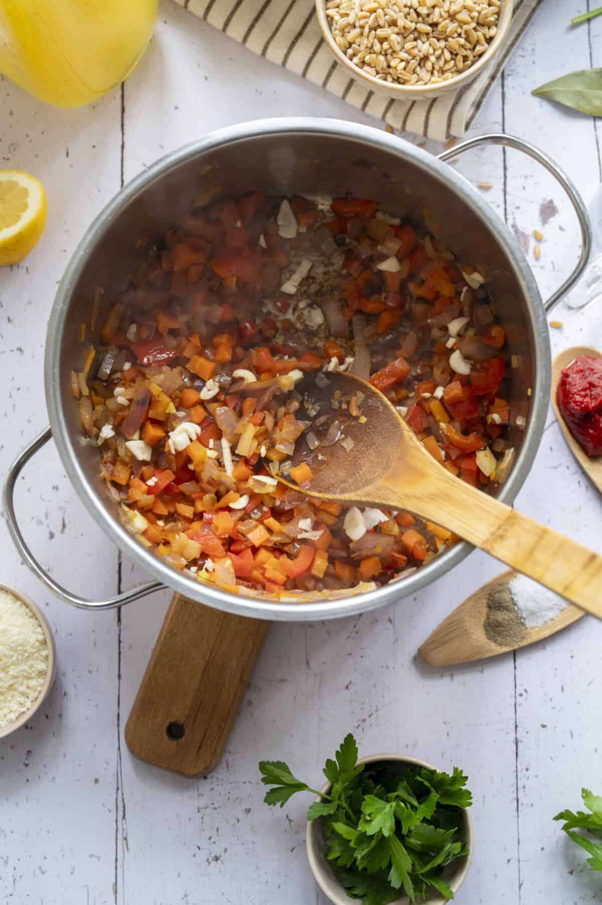 A pot of sauteed veggies and garlic.