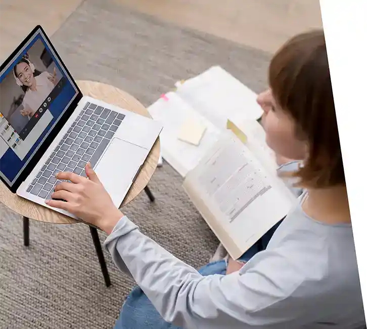 Woman studying during online video call at home