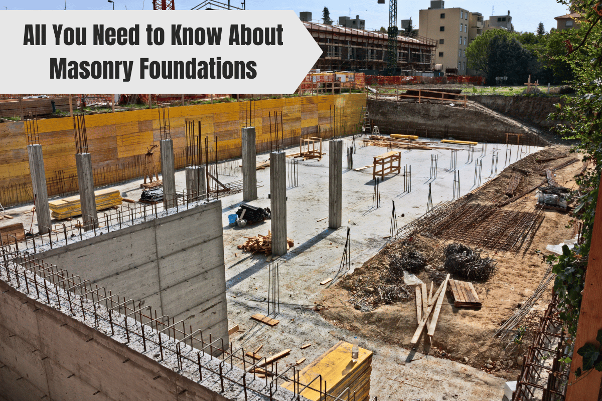 Construction site with concrete foundation walls and rebar