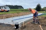 Concrete paving process on construction site by Graham Harris in NZ, skilled work in groundwork and civil engineering.