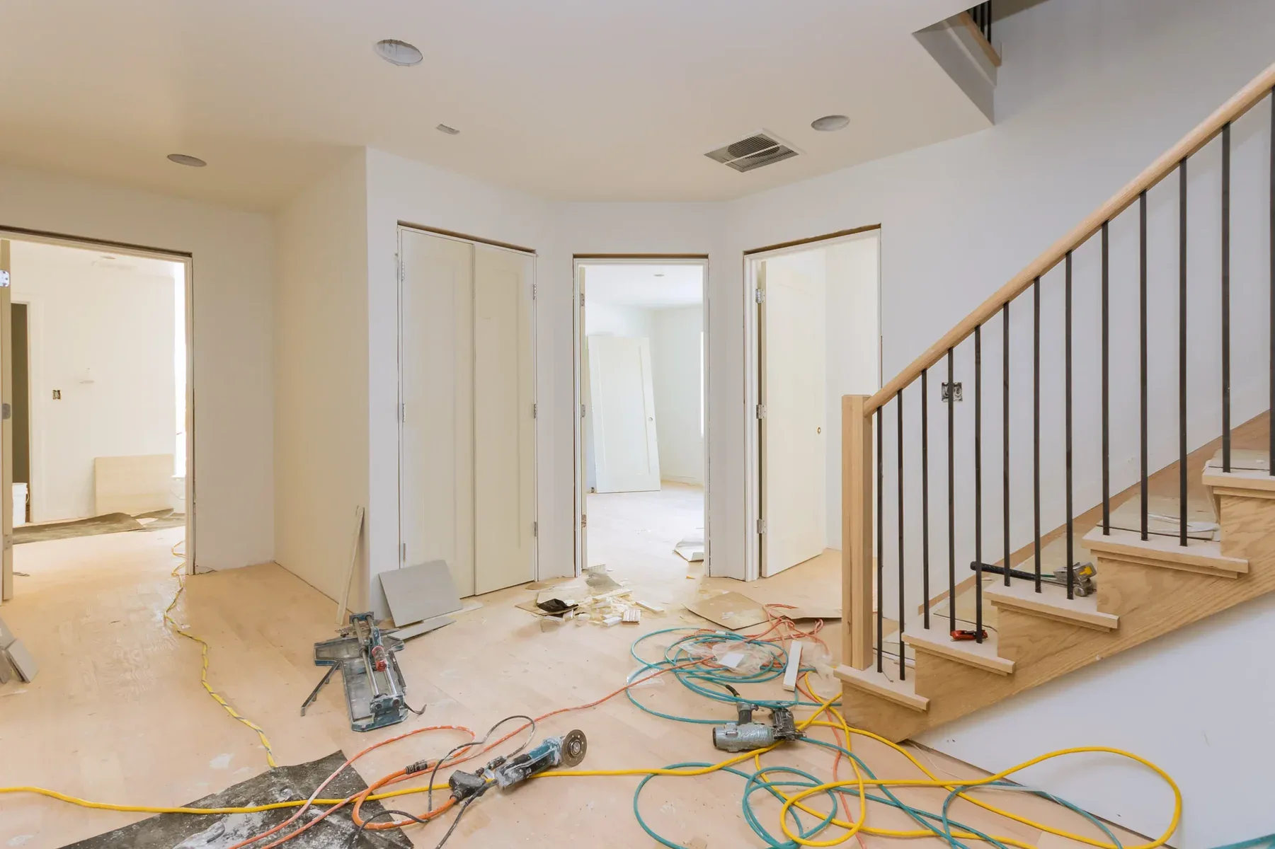 Interior of a house under construction with tools and materials on the floor