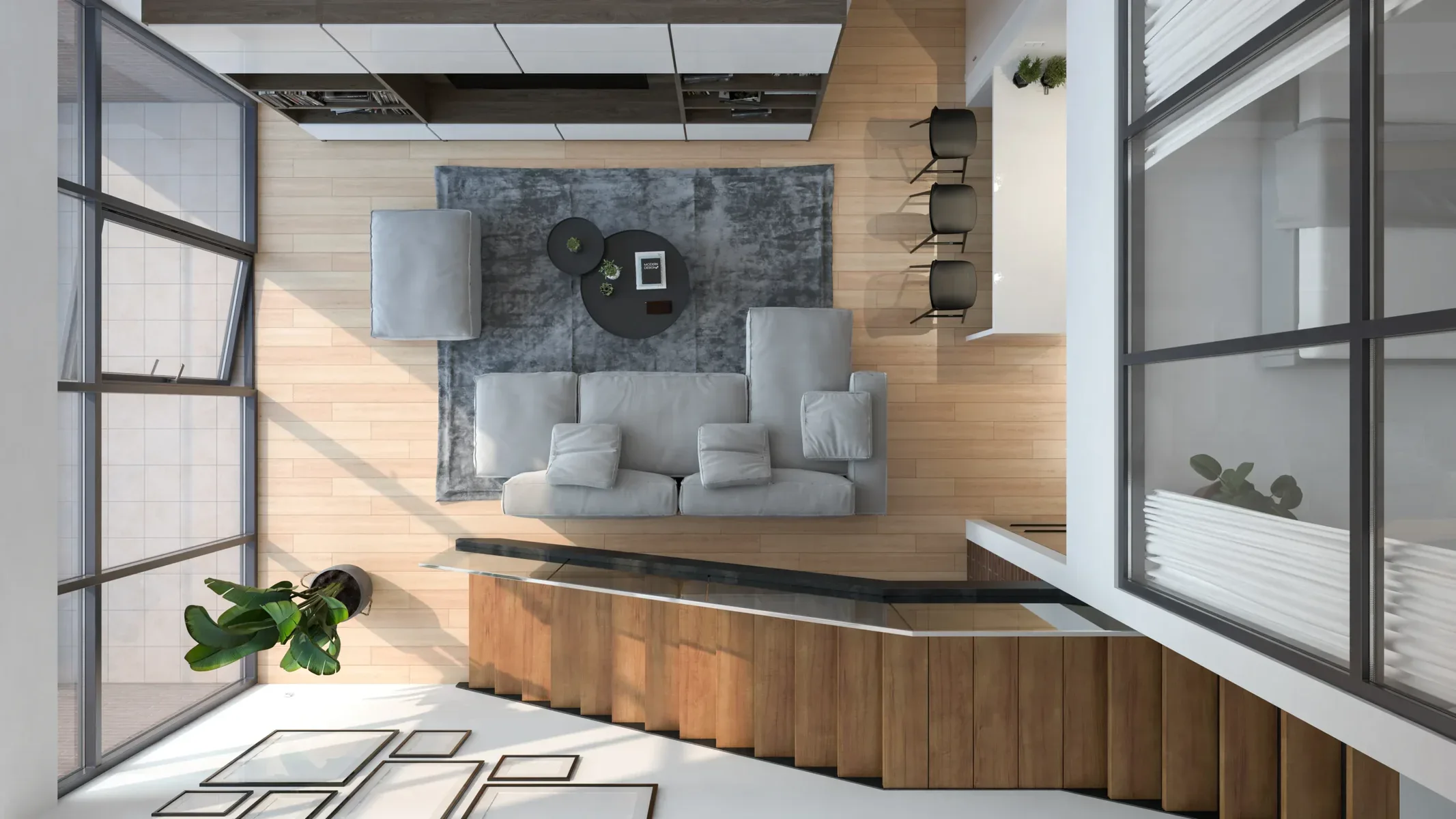 Overhead view of a modern living room with a light gray sofa and wooden floors.