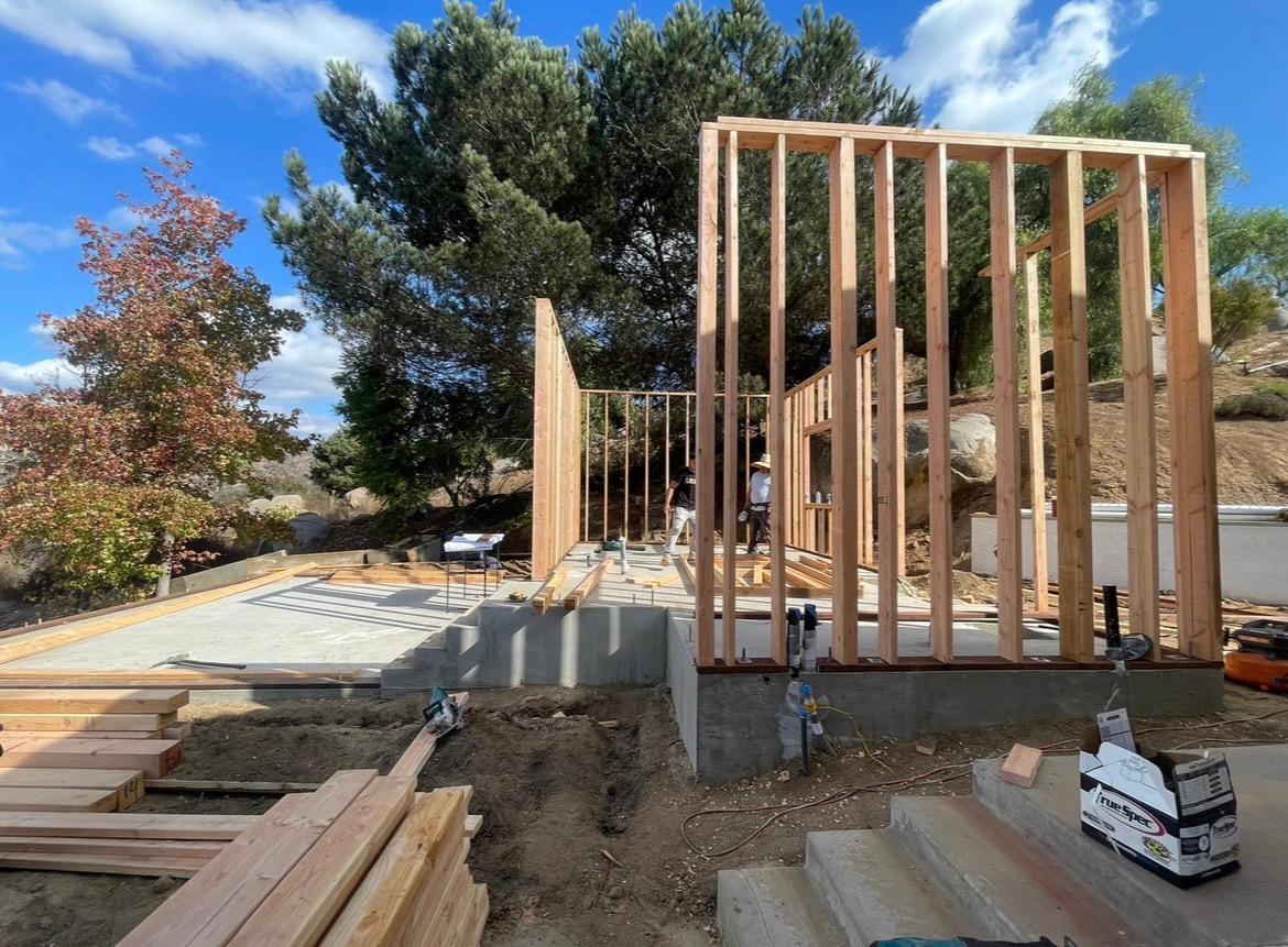 Wooden framework of a house under construction on a sunny day