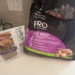 a fresh dog food bag next to dry dog food bag