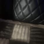 a couch cover on a leather couch