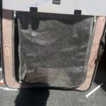 a kennel in the back of SUV for dog