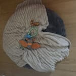 a toys and treats on dog bed