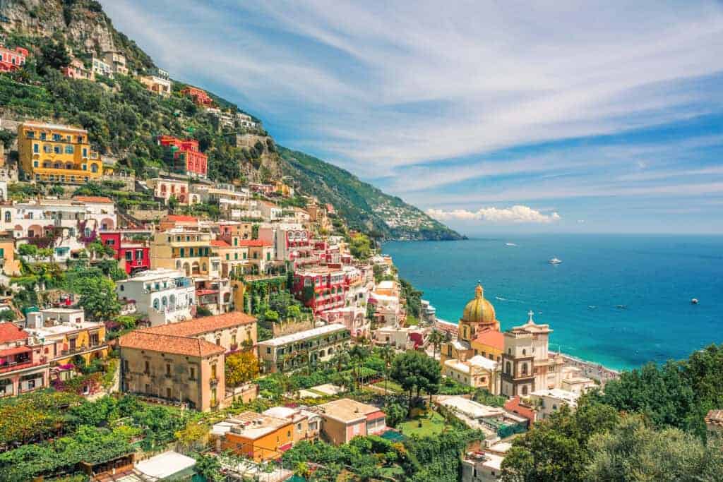 Aerial view of hillside town of Positano on the Amalfi Coast with beautiful blue sea