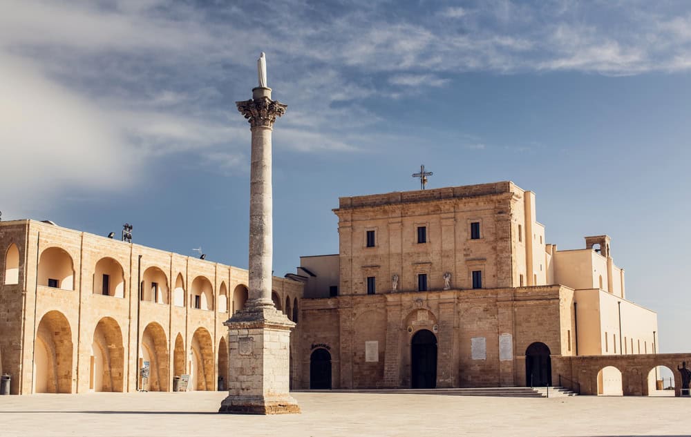 View from the Piazza of the Stone arched facade of the Sanctuary of Santa Maria di Leuca. Puglia. Italy.