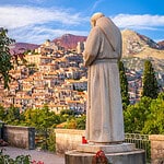 Distant view of the village of Morano Calabro from a Terrace with a Stone statue