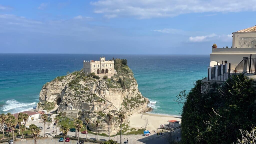 Cliffside church overlooking Tropea beach in Italy.