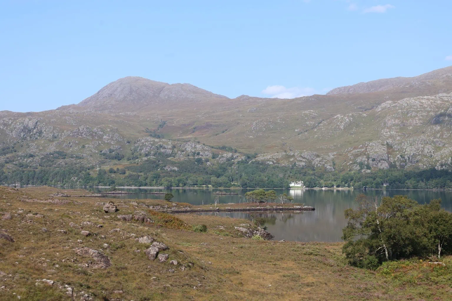 Loch Maree, Scotland on a hazy blue sky day