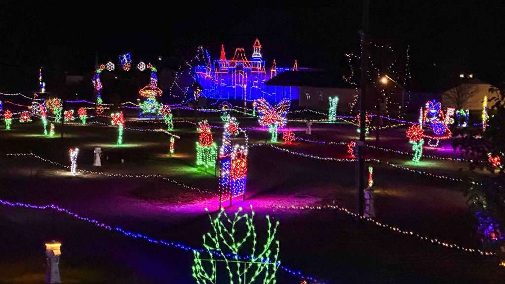 a shot of christmas lights in the dark background