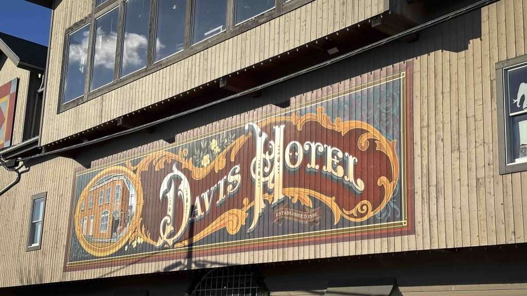 the exterior wall of the Davis Mercantile with a mural of the Davis Hotel