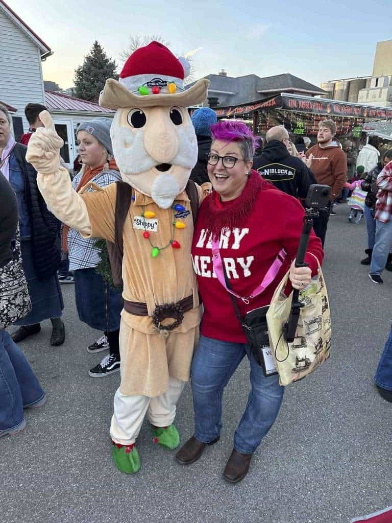 The pink-haired Hip Grandma poses with Shippy, the mascot for Shipshewana at the Lighting up Shipshewana event