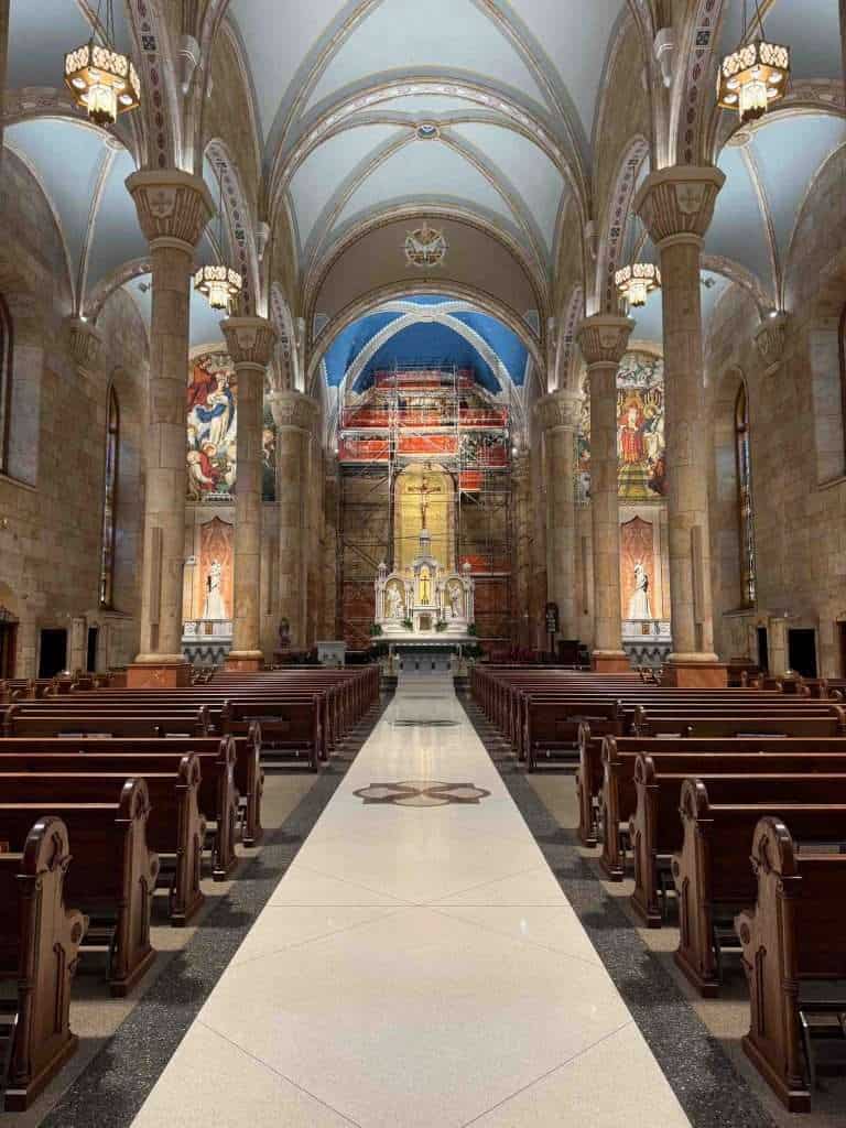 interior view of a catholic church showing pews and the pulpit