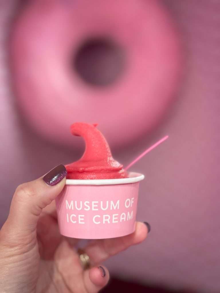 Pink cup of sorbet held at the Museum of Ice Cream in Chicago.