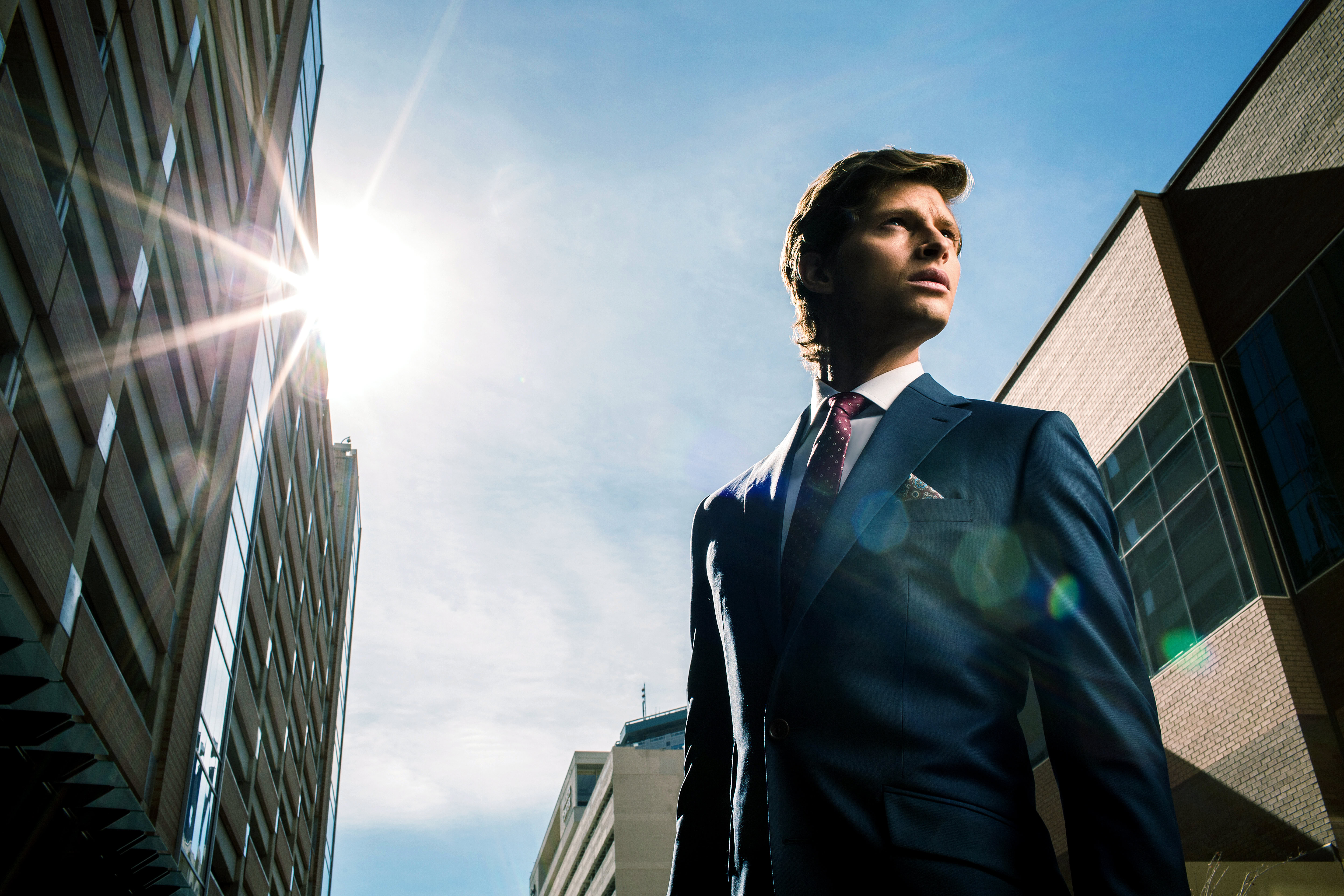Business professional in cityscape with sunlight, emphasizing pricing strategies.
