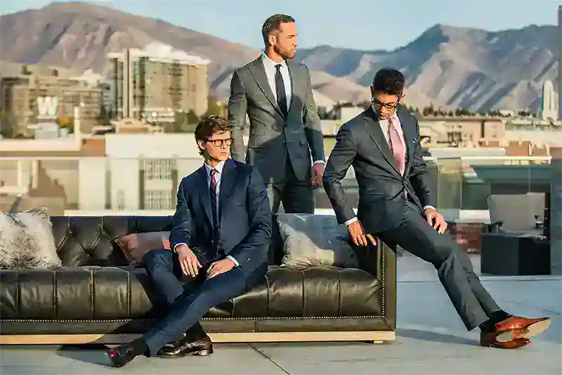 Boise ID schedule: Business team on rooftop with cityscape and mountains.