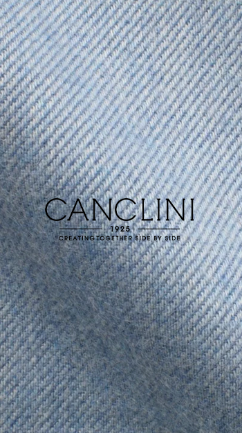 Close-up of Cancelini fabric showcasing fine diagonal weave in light blue.