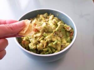 Image shows chip with a bit of guacamole.