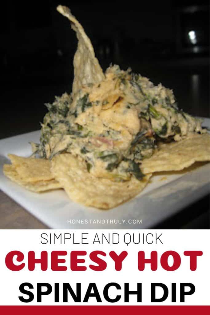 Image shows cheesy hot spinach dip on top of tortilla chips.