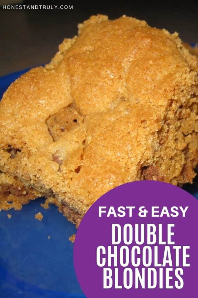 Image shows close-up picture of double chocolate blondies on a plate.