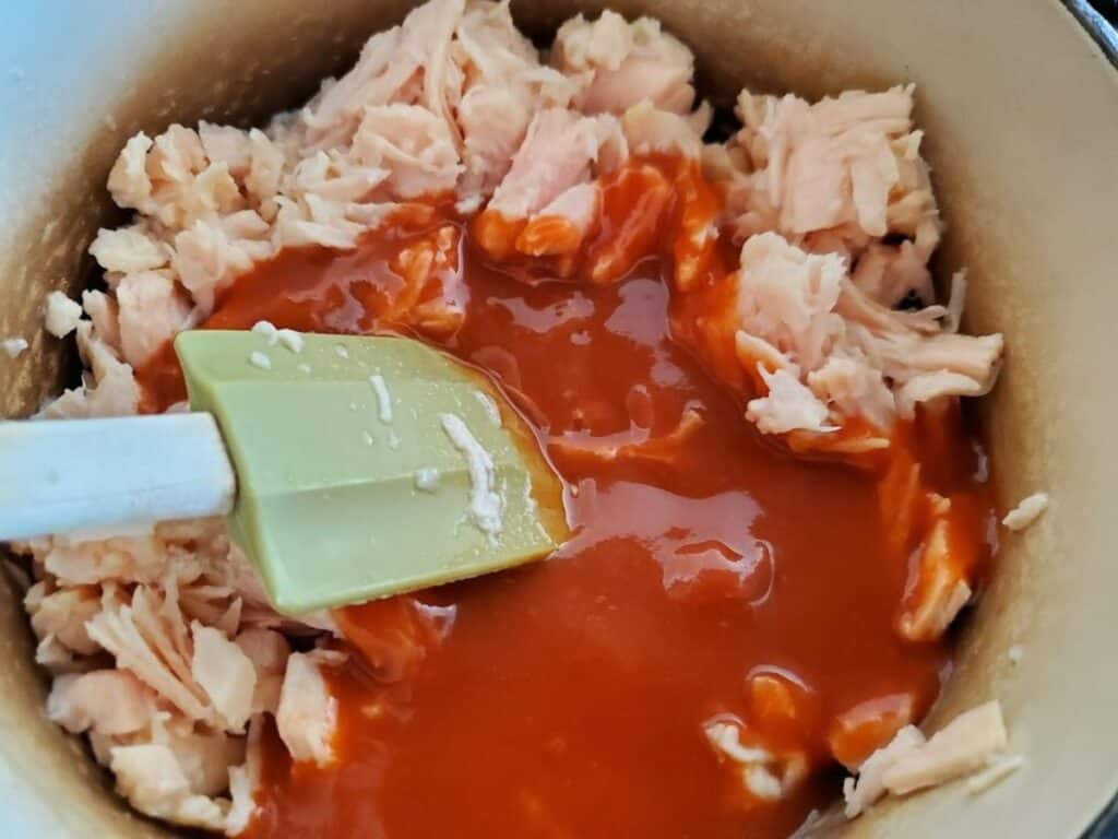 Image shows hotsauce added to chicken.