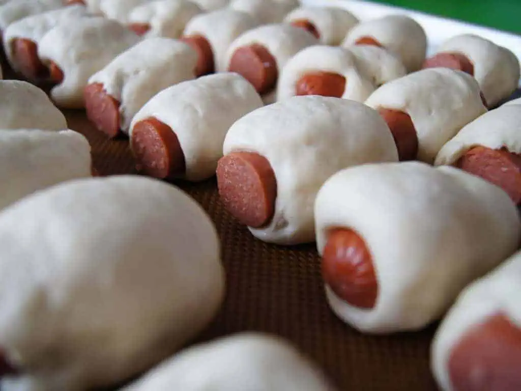 Image shows ready-to-be-cooked bagel dogs.