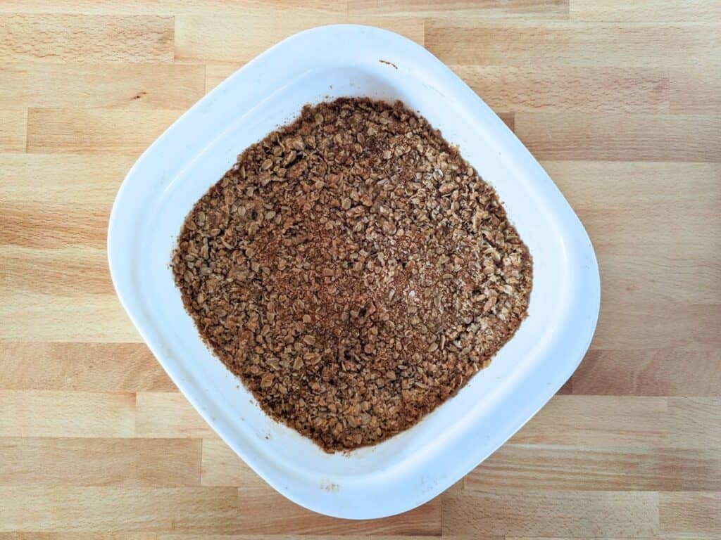 Image shows an Overhead of Baked raspberry jam bars in the pan.