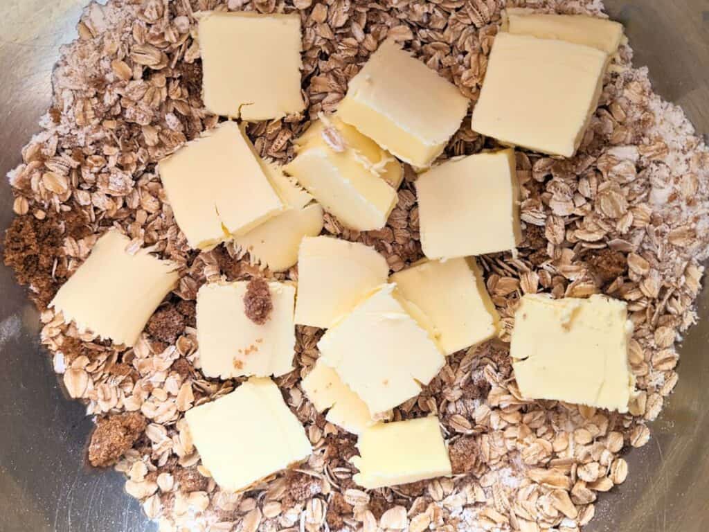 Image shows an Overhead of jam bar crust ingredients in a bowl.