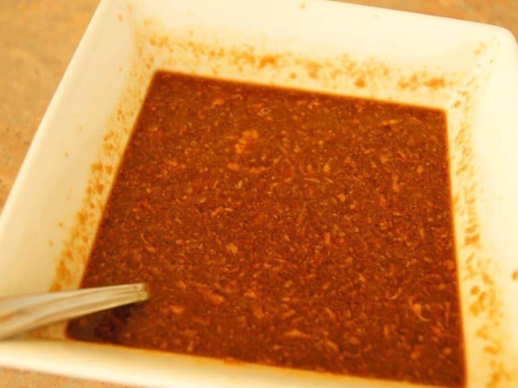 Image shows sauce for peanut chicken in a bowl.