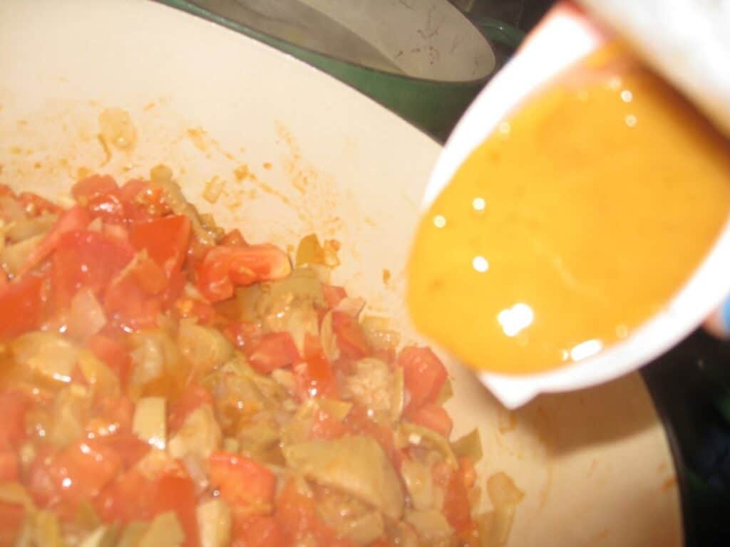 Image shows adding knorr to the sauteed vegetables.