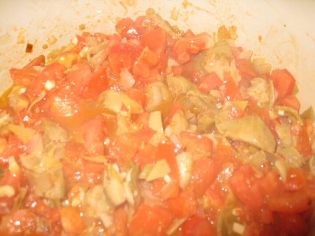 Image shows sauteeing vegetables.