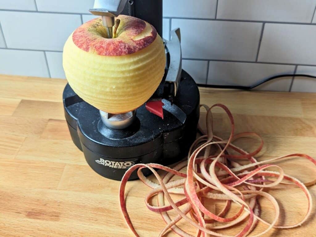 Image shows apple peeled using a peeling machine.