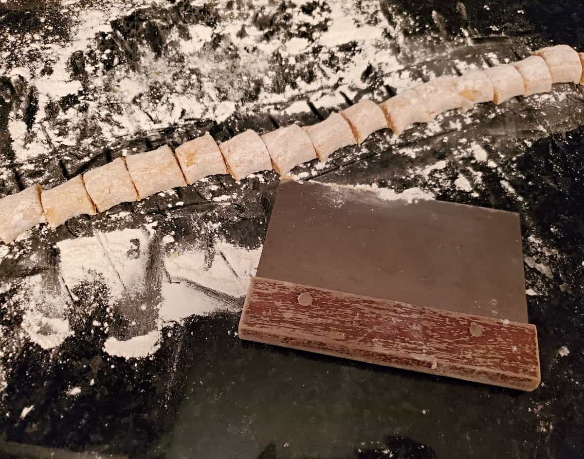 Pumpkin donut holes cut with a bench scraper.
