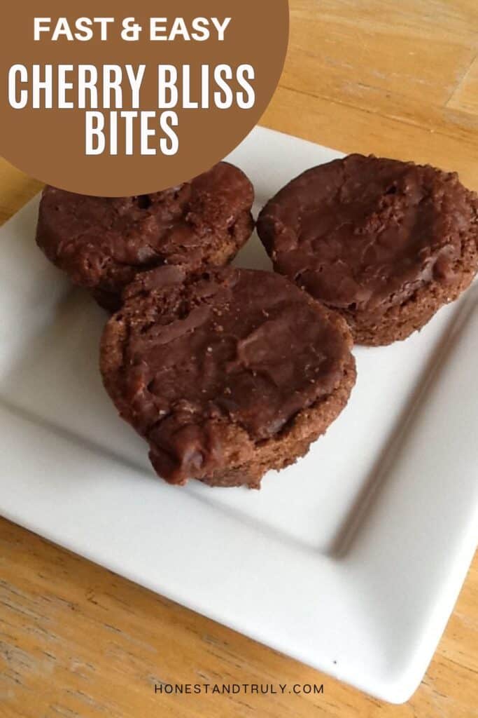 Image shows close-up picture of cherry bliss bites on a serving plat.