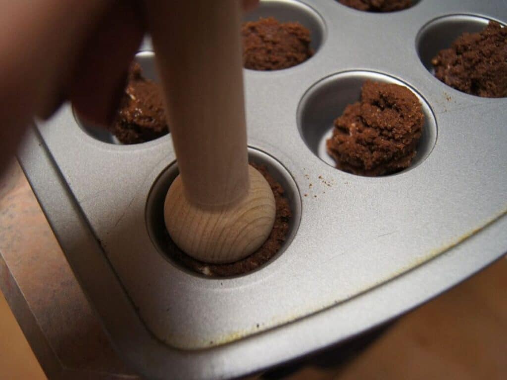 Image shows forming the crust of cherry bliss bites.