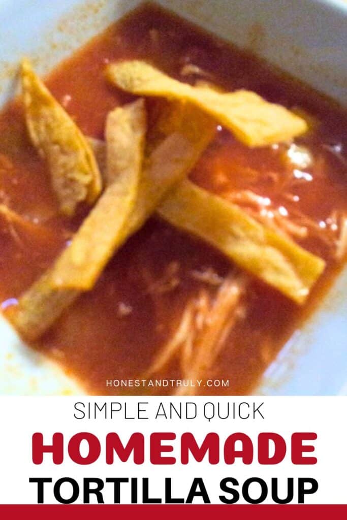 Image shows close-up picture of homemade tortilla soup in a bowl.