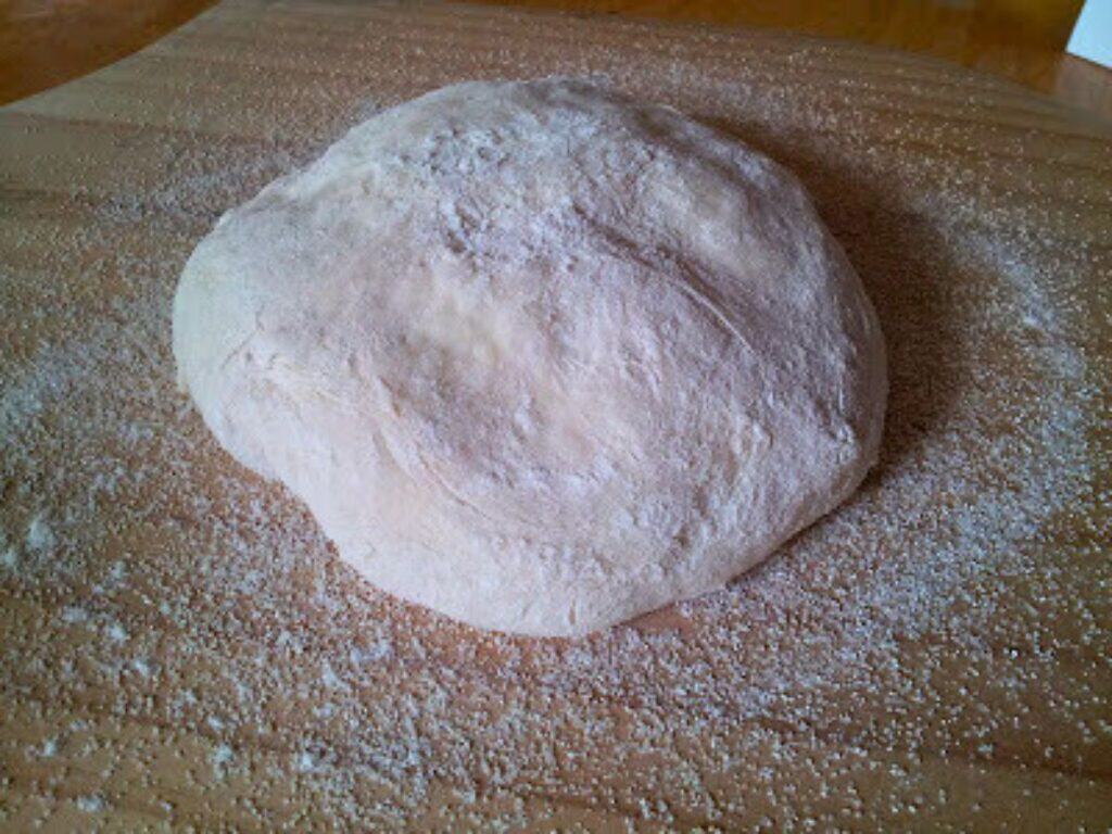 Image shows bread dough ready to rise.