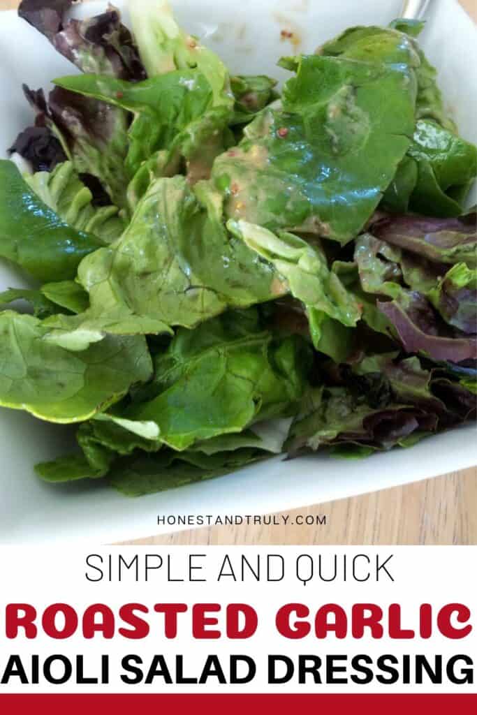 Image shows close-up picture of salad with roasted garlic aioli on top.