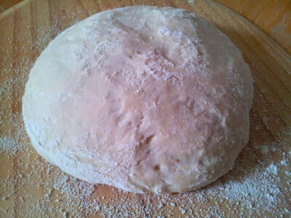 Image shows risen bread dough.