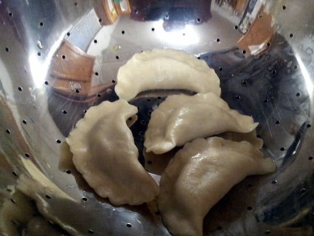 Drain pierogies in a colander without them touching