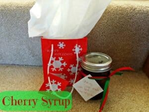 Cherry syrup in a jar with Christmas bag