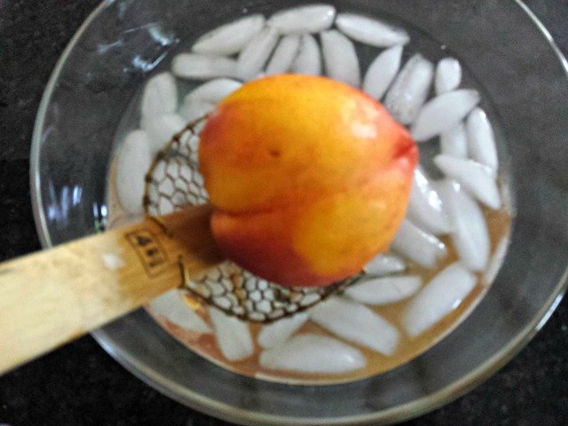 Add blanched peach to your ice bath
