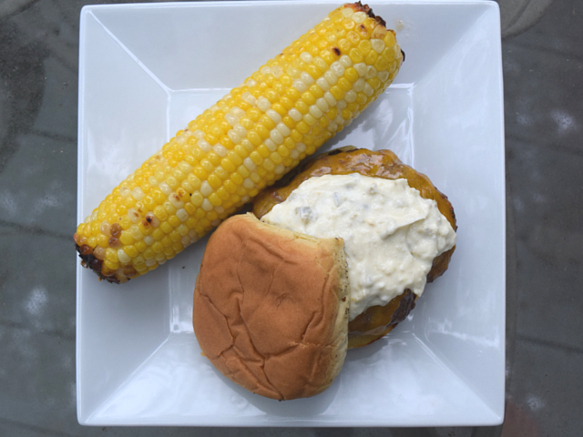 About to eat chipotle burger and chipotle grilled corn