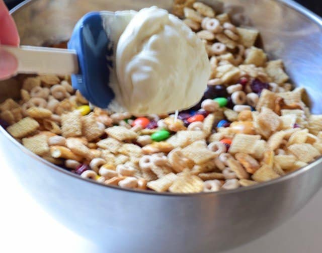 Add melted chocolate a dollop at a time