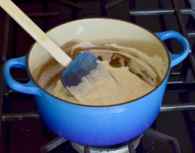 Melt white chocolate over low heat stirring frequently