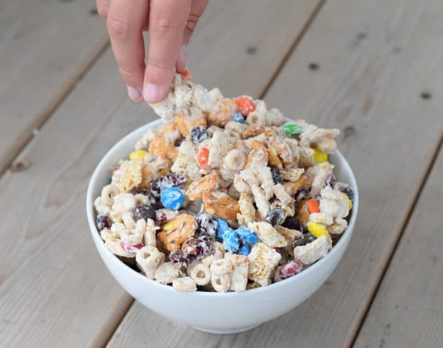 Sneaking some of the white chocolate party mix