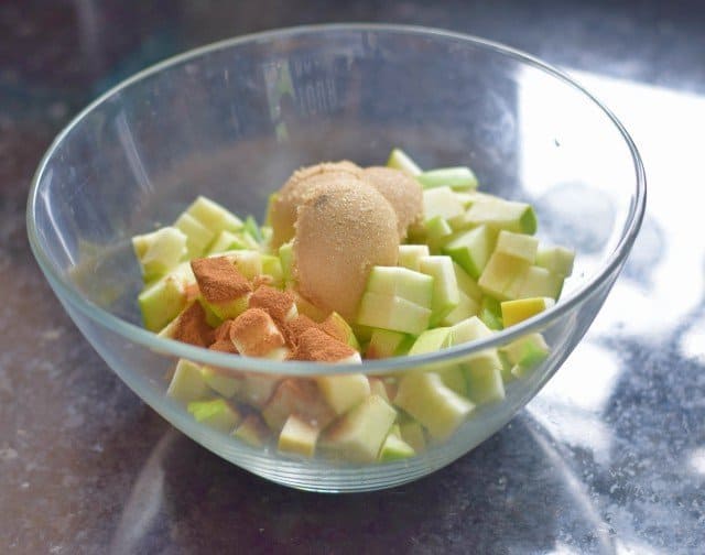 Add brown sugar and cinnamon to chopped apples